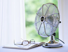 A small fan in a window